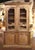 An impressive example of 18th-century French provincial craftsmanship, this antique buffet à deux corps combines intricate...