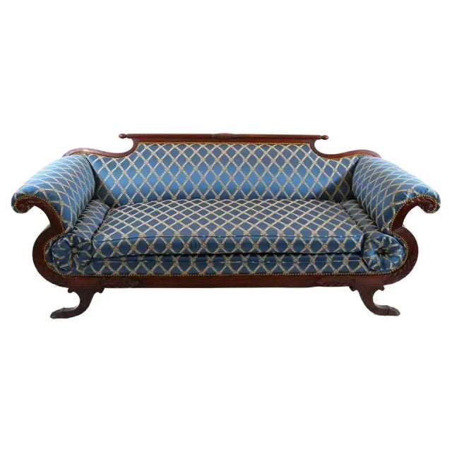Very beautiful North American Empire style mahogany wood framed upholstered sofa with matching bolster pillows and...