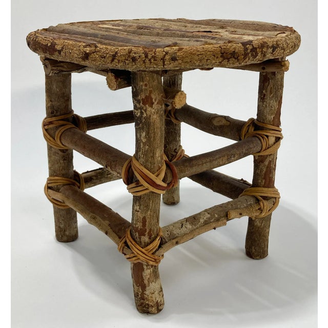 Unique stool made entirely of twigs and coiled wrap. Very sturdy. Ideal as a seat or plant stand. Measures 11"H. Sturdy....