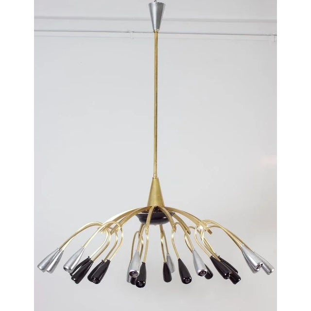 Linear elegance, brass and black painted six arms chandelier, holding round opaline glass shades. Excellent vintage...