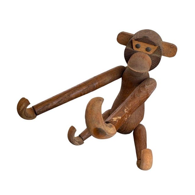 This charming wooden monkey, crafted in the style of Kay Bojesen's iconic design, captures the playful essence of mid-...