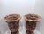 Vintage pair of hand-woven wicker/rattan/seagrass urn-style pedestal vases featuring a flared, braided rim and a footed...