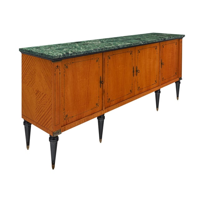 Buffet from France in the Modernist style with neoclassical lines. This piece boasts a striking flamed sycamore with a...