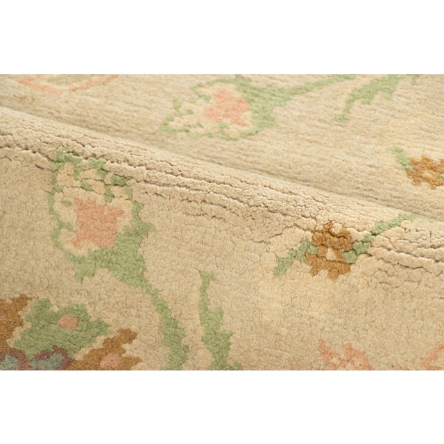 This oversized vintage 12x14 Spanish Oushak rug is a graceful mid-century piece from Rug & Kilim’s collection of European...