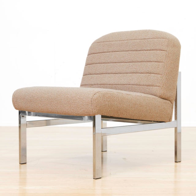 A striking set of eight British mid-century modern lounge chairs, originally commissioned for a corporate interior and...