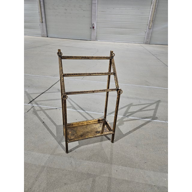 Used and its in good condition. Shows normal use and age. This vintage Hollywood Regency 3-tier floor towel hanger rack is...