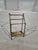 Used and its in good condition. Shows normal use and age. This vintage Hollywood Regency 3-tier floor towel hanger rack is...