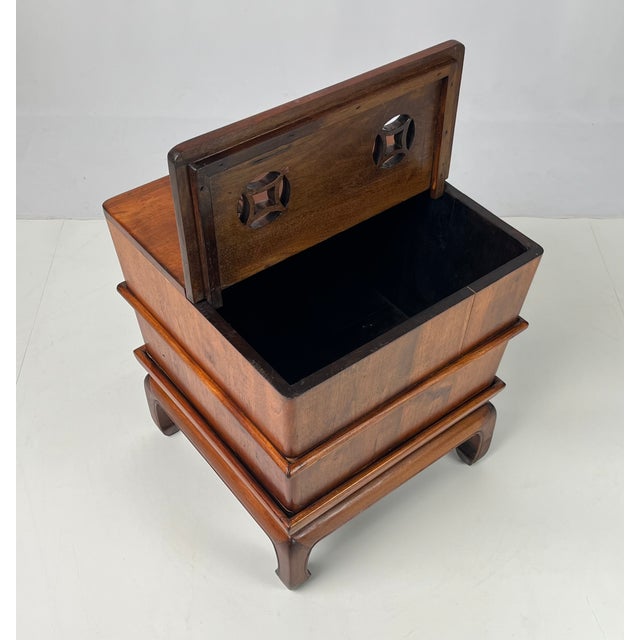 Vintage Chinese Ming-style hardwood accent table. Crafted with clean lines and warm, rich wood grain tones, this piece is...