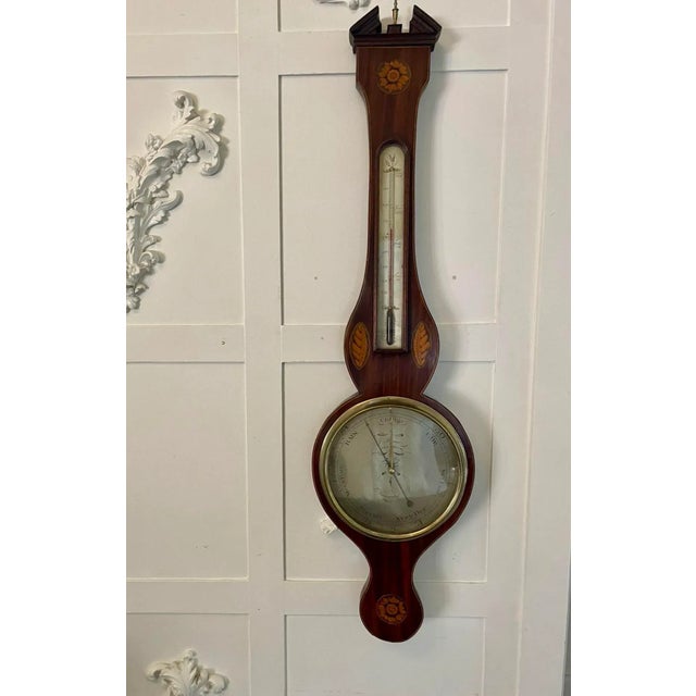 Antique George III quality mahogany inlaid banjo barometer having a swan neck top, quality mahogany case with inlaid...