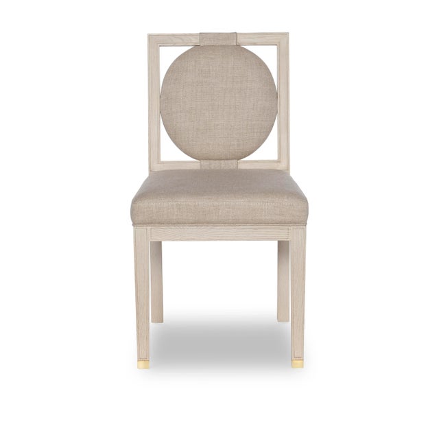 The Lea Side Chair features a floating upholstered circle back that wraps cleanly into the beautiful oak frame that...