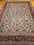 An exquisite vintage Persian Isfahan rug, hand-knotted with remarkable precision in the mid 20th century. This elegant...