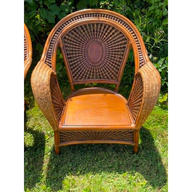 Stunning pair of Pier 1 woven Rattan Web Lounge Chairs. Beautiful vintage condition. Cushions with silk rope ties are for...
