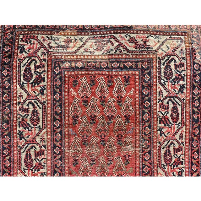 Measures 3'2 x 15'2 This century old Persian Malayer defines the craftsmanship of this era. The multi-tier border features...