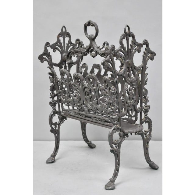 Vintage French Renaissance Victorian Style Cast Iron Magazine Rack with Cherubs. Weight approx 25 lbs. Circa Mid 20th...