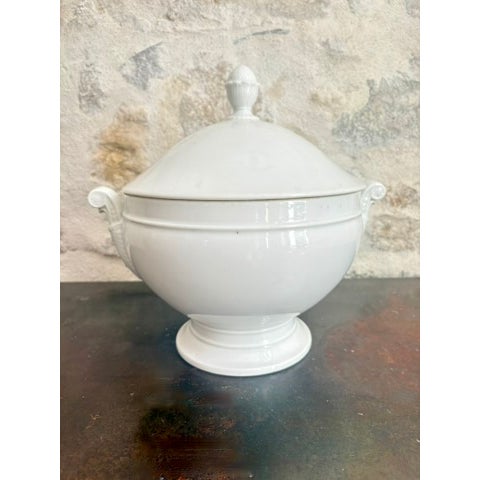 Antique French white porcelain soup tureen, circa late 19th to early 20th century. Round body on a pedestal foot, domed...