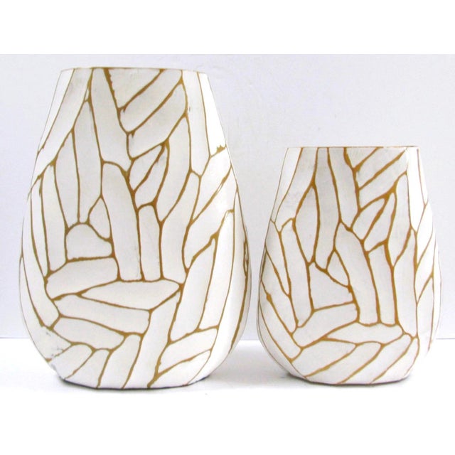The Pair of Currey & Company Anika White with Gold Accent Vases is a stylish addition to any modern home decor. Made of...