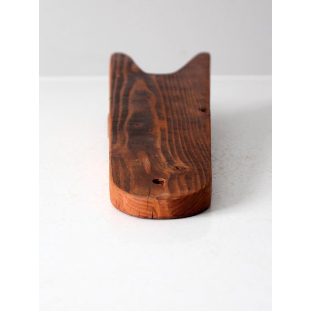 This vintage wood boot jack is a rustic and functional piece for removing your boots with ease and adding a touch of old-...