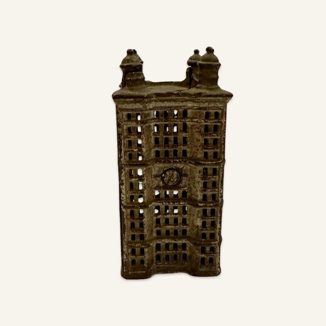 These cast iron banks were given as rewards for bank customers opening new accounts. Mostly directed at children to...