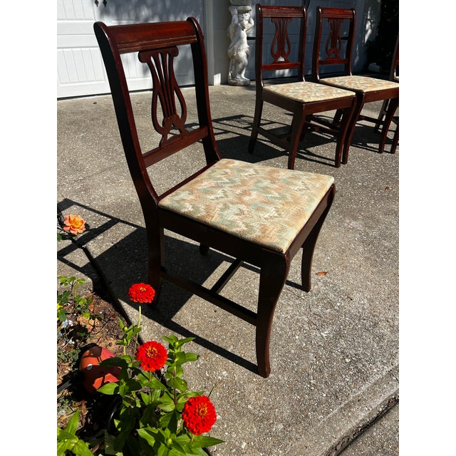 Up for consideration is a beautiful vintage harp lyre back wooden dining chairs. These would look lovely in your home, and...