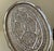 An Anglo Indian or Persian oval tea tray executed in white metal marked/stamped: silver. It is un-magnetic and we have not...