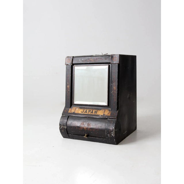 This is an impressive Victorian mercantile tea bin. The large black tin caddy features a beveled glass mirror front with a...