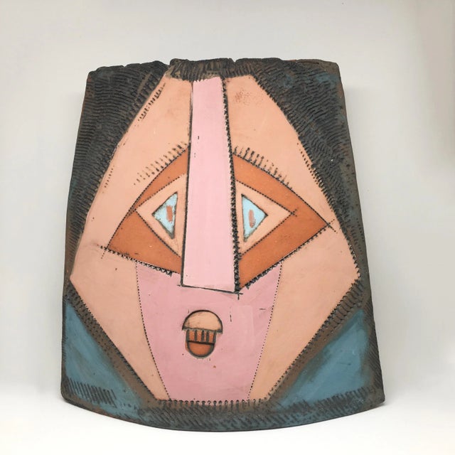 Cubist faces artist signed studio pottery vase with surreal faces on both sides. One side portrays two faces (perhaps in a...