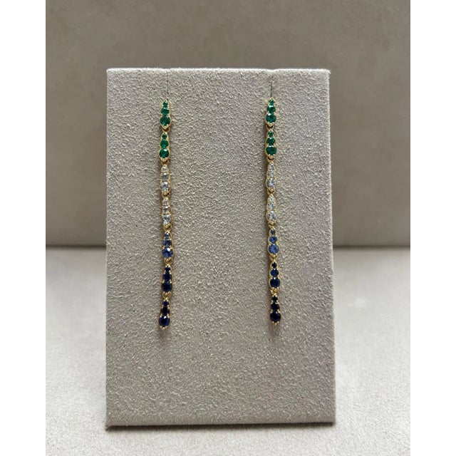 Created in 18 karat yellow gold Emeralds 0.35 carat approx. Sapphires 1.30 carats approx. Post backs for pierced ears...