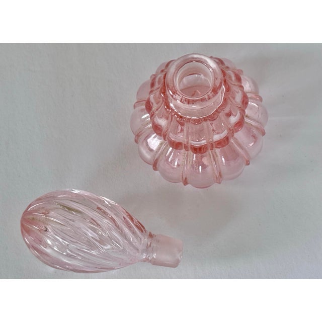Soft pink perfume bottle with stopper. Most items found at Pub & Oasis are vintage and antique in nature which we believe...