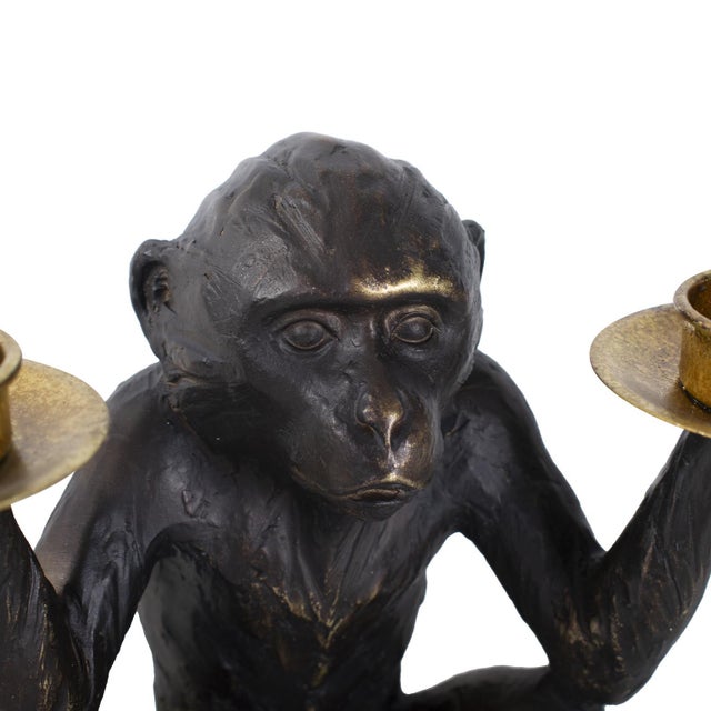 Playfully balancing tealight candleholders in each hand, this intricately detailed Barkari monkey sculpture adds an...