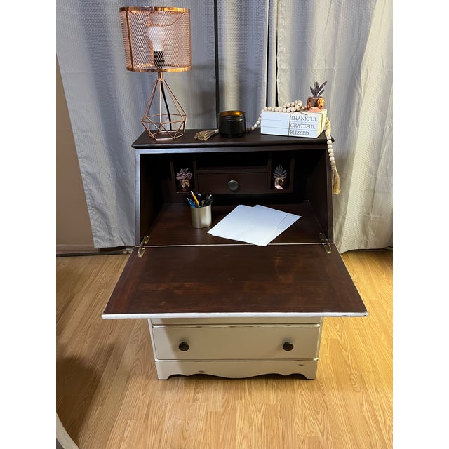 Charming mid-20th-century drop-front secretary desk featuring classic Early American/Colonial Revival styling. This...