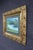 Antique-style ornate gilt wood frame with rich scrolling detail and pierced decoration, paired with a soft landscape...