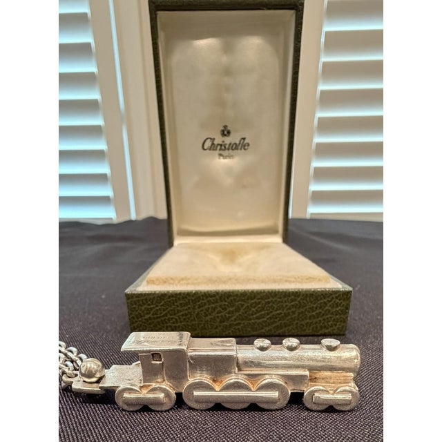 Christofle Locomotive Engine, Keychain Sterling Silver and in original formed box Detailed design of a locomotive engine...