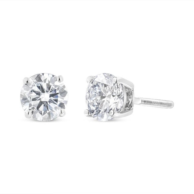 Two gorgeous near-colorless white diamonds sit in a prong setting on these sparkling stud earrings. Crafted in solid 14k...