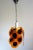 Vintage 1970s space age chandelier inspired by Gino Vistosi. Metal frame. 16 orange/black colored acrylic glass discs...