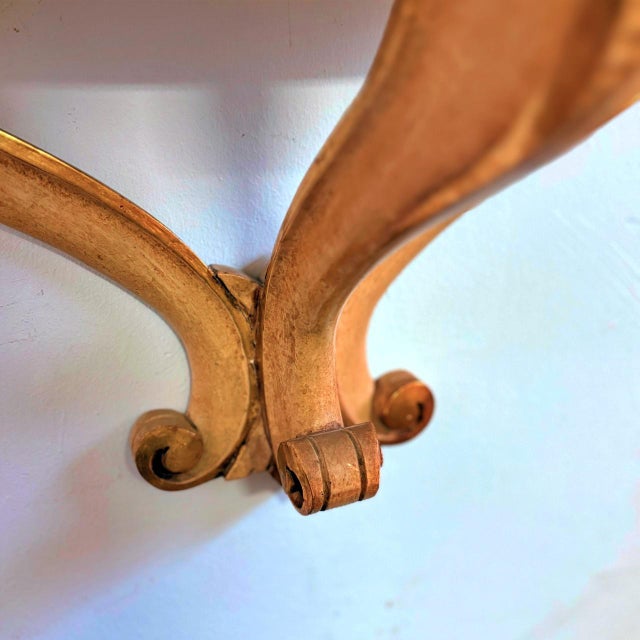 Wooden console table, Italian artisan production from the 1940s or 1950s, cream-colored with gold leaf details. Beautiful...