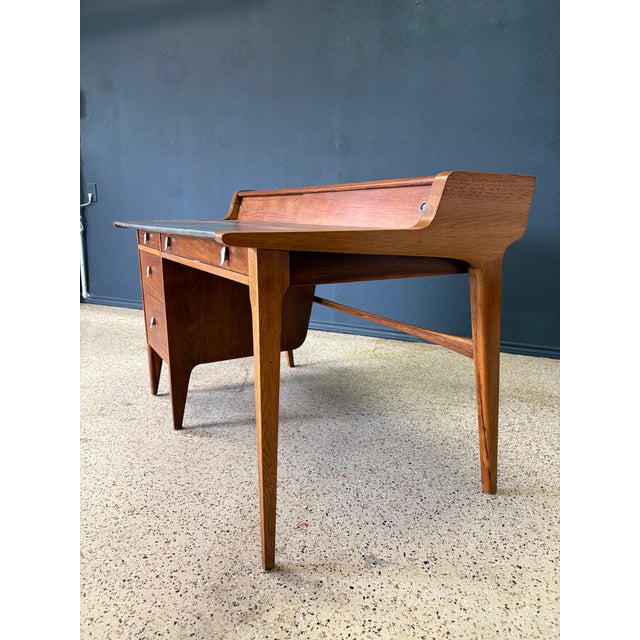 Strong bold design by John Van Koert for Drexel furniture. A combination of walnut and oak makes this desk a stunning...