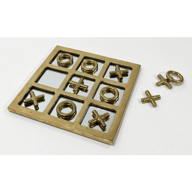 Large vintage brass mid century modern style tic tac toe board with mirrored surface. Heavy brass frame and playing...