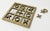 Large vintage brass mid century modern style tic tac toe board with mirrored surface. Heavy brass frame and playing...
