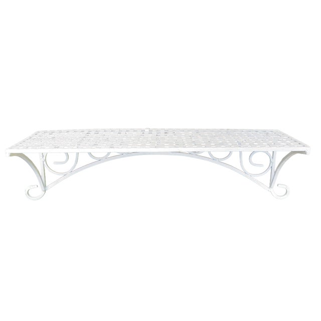 A charming French-inspired vintage wall shelf crafted from woven metal lattice, featuring an airy openwork design and...