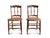 A graceful pair of spindle back cane chairs made in the 1940s era. The farmhouse chair pair feature two turned spindles,...