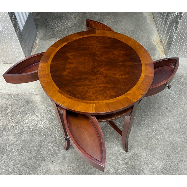 Great little regency style accent table by The Bombay Company. Mahogany with a banded top with burled veneer center....