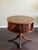 An elegant vintage revolving drum library table crafted in the Duncan Phyfe tradition with a mahogany finish, inset...