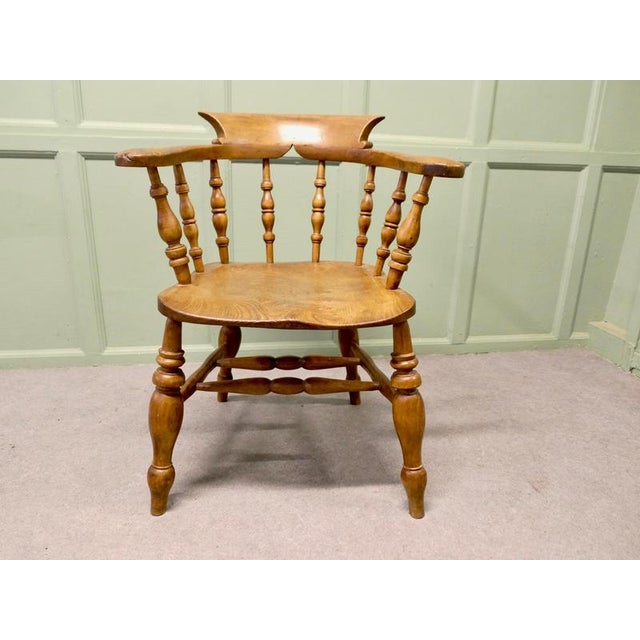 19th Century Beech and Elm Smokers Bow Office or Desk Chair This solid chair has an attractive thick saddle shaped seat in...