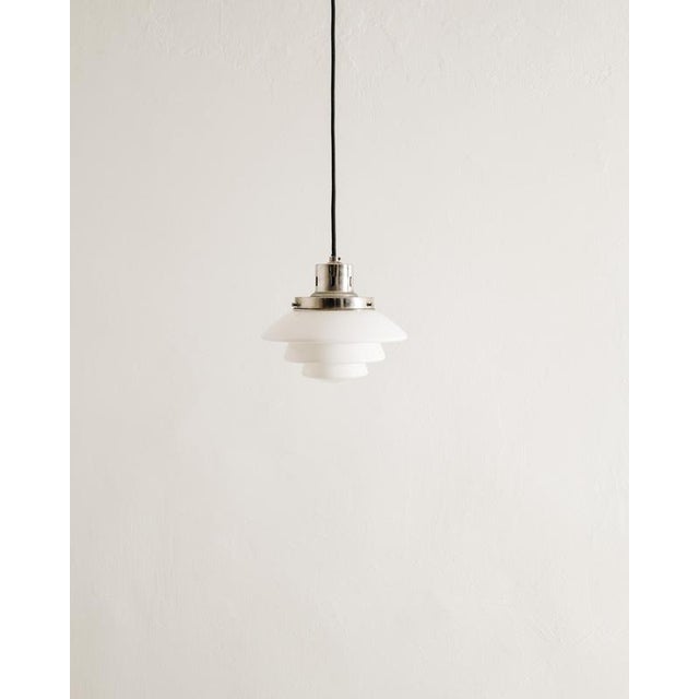 Rare and early Finnish mid century "1612" pendant in patinated chrome with a white original opaline glass shade model...