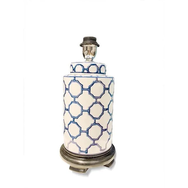 Blue White vase lamp is delightful with the heptagon pattern. The contrast is sharp on a walnut base with a rounded shade....