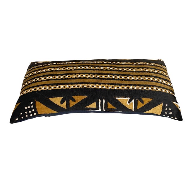 This long pillow features a superb Vintage African hand woven cotton mud cloth from Mali, showcasing beautiful shades of...