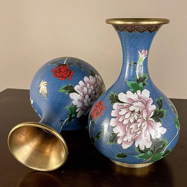 Pair Antique Cloissone Vases is a timeless example of the genre, displaying a well-preserved, rich coloration and...