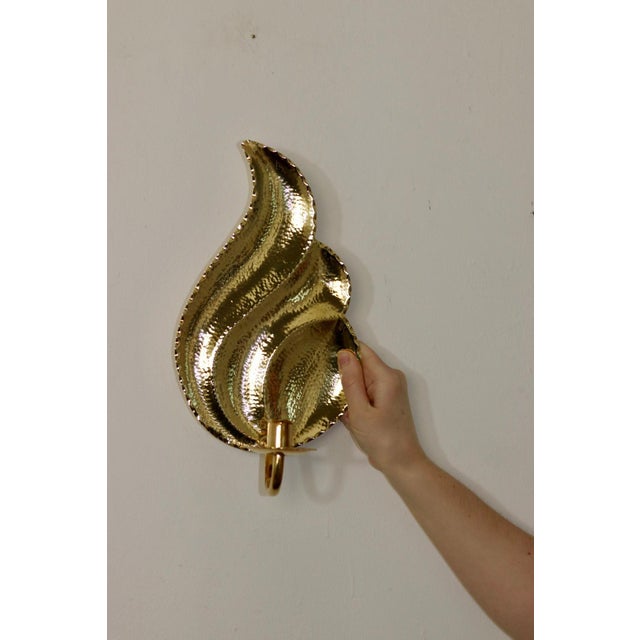 Elegant Pair of Swedish wall sconces by L. Andersson Fågelmara, crafted from hammered repoussé brass. these pieces blends...