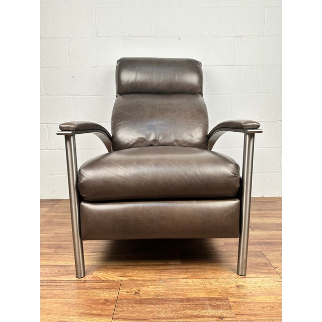 Radius Leather Recliner by Ethan Allen. The contemporary silhouette has a nickel-plated steel frame enhanced with...