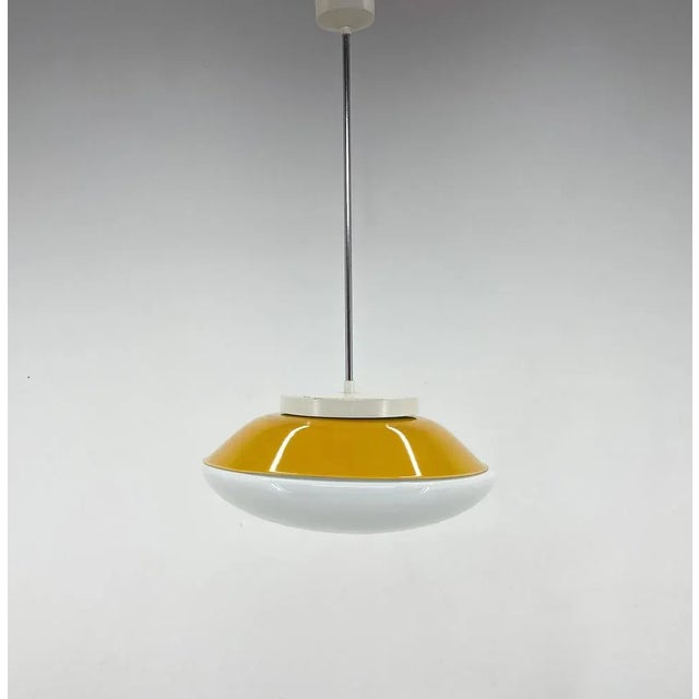 Mid-century pendant produced in former Czechoslovakia in the 1970s. Up to 250V (Europe/UK Standard).The wiring of this...